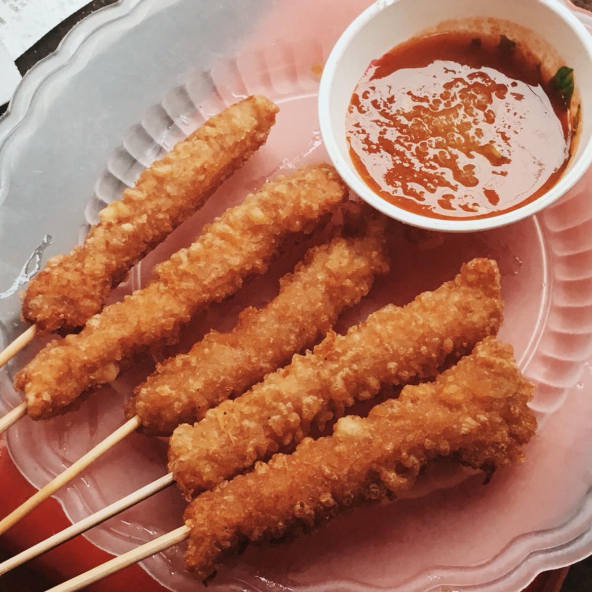 Nem chua - fried spring roll  on sticks